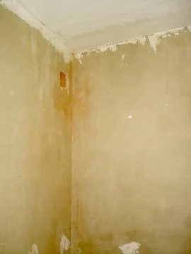 Renovation in Progress Showcasing Rough Plastered Walls and Unfinished Detail Stock Photos