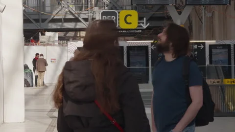 Renovation scene at Paris Austerlitz train station with commuters and RER C Stock Footage 306573066
