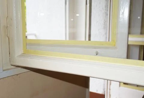 Renovation Window Frame Protected With Masking Tape Before Painting Stock Photos