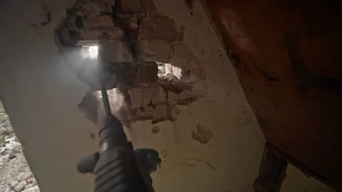 Renovation work is ongoing, emphasizing demolition techniques that improve Stock Footage 313845248