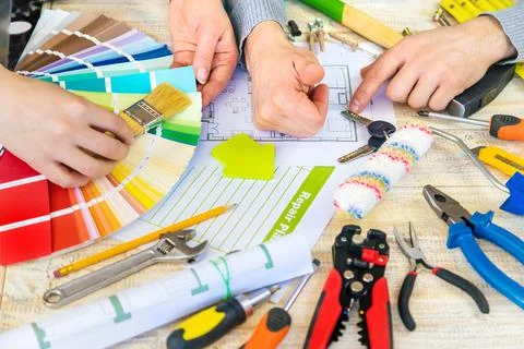 Renovation work to select the color of the paint according to the palette. Se Stock Photos