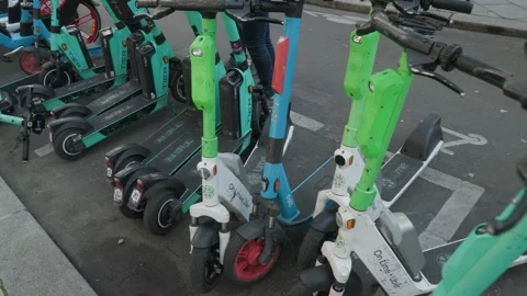 Rental e-scooters in a row in Paris Stock Footage 246645169