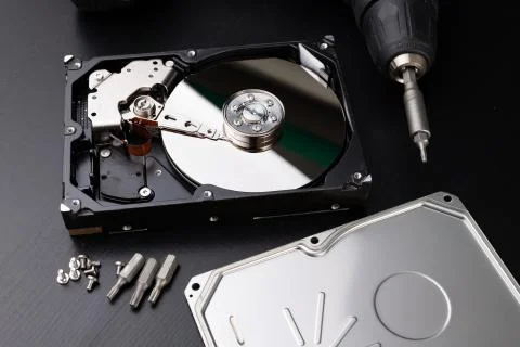 Repair and diagnostics of hard disk. Service of computer parts in the worksho Stock Photos