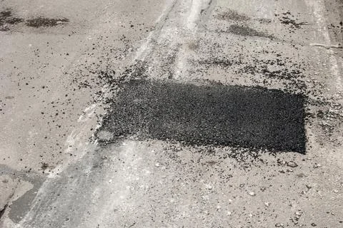 Repair asphalt patch Stock Photos