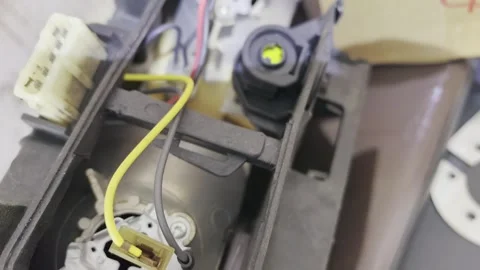Repair of a broken device with focus on wiring and connection in a workshop envi Stock Footage 332164313