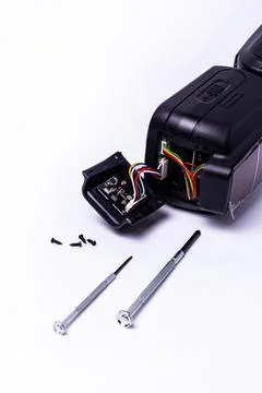 Repair of the camera's on-camera flash. camera service center. Stock Photos