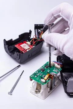 Repair of the camera's on-camera flash. camera service center. Stock Photos