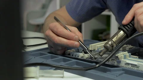 Repair computer circuit board:placing connector on the laptop motherboard. Stock Footage 133000404