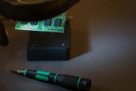 Repair of computer components, RAM under a magnifying glass Stock Photos