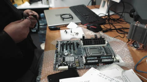 Repair computer service technician assembles a new motherboard to computer. Man 動画素材 134841956