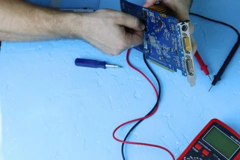 Repair an electronic device using Multimetr Stock Photos
