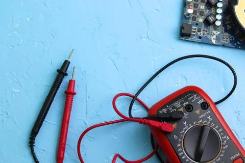 Repair an electronic device using Multimetr Stock Photos