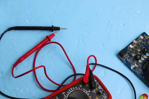 Repair an electronic device using Multimetr Stock Photos