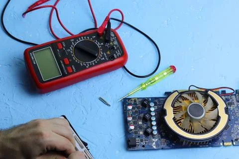 Repair an electronic device using Multimetr Stock Photos
