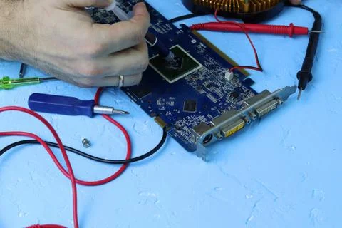 Repair an electronic device using Multimetr Stock Photos