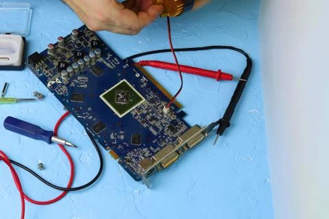 Repair an electronic device using Multimetr Stock Photos