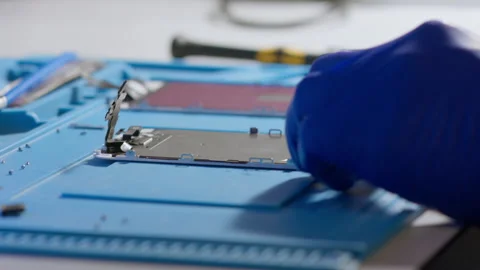 Repair of electronic devices. Assembling and disassembling smartphones. Video stock 166919799