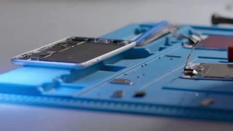 Repair of electronic devices. Assembling and disassembling smartphones. Stock Footage 166920195