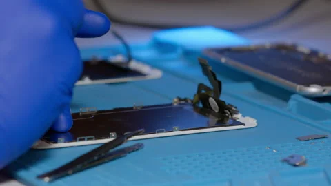 Repair of electronic devices. Assembling and disassembling smartphones. Stock Footage 166921836