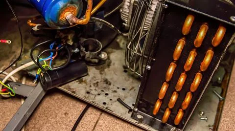 Repair of the engine of an industrial refrigerator unit. 스톡 사진