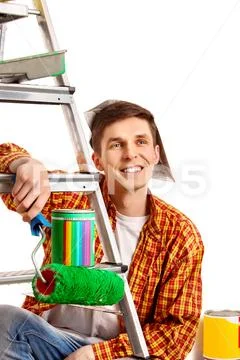 Repair home man holding paint roller for wallpaper. Stock Photos