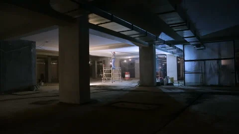 Repair inside the building. Worker plasters ceiling Stock Footage 115862689