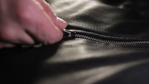 Repair of lightning on leather jacket in the studio Stock Footage 102106555