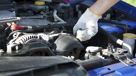 Repair man checking car engine oil Stock Footage 73554681