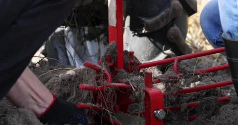 Repair of the minitractor. Replacement of the plow. Stock Footage 220729496