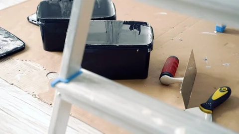 Repair. Paint, working tools, spatulas on cardboard Stock Footage 114240550