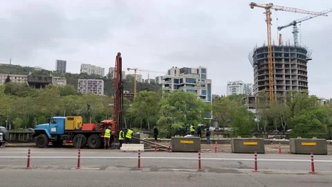 Repair process. Collapse of section of road on left embankment of Mtkvari Video stock 306633945