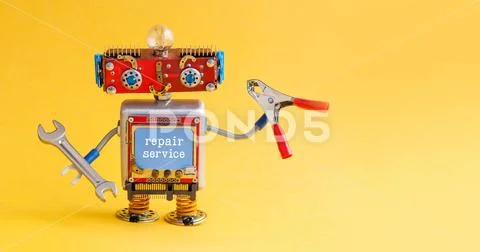 Repair service robot handyman master with hand wrench red pliers. Creative Stock Photos