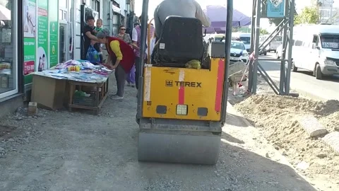 Repair of the sidewalk with a small seal. Stock Footage 252128269