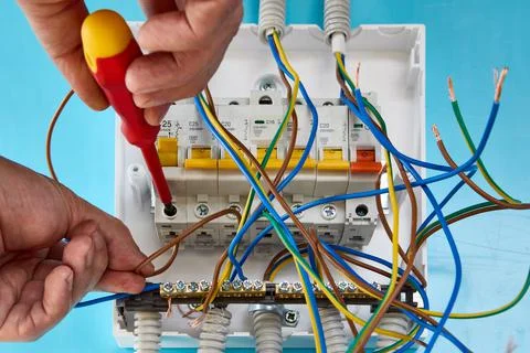 Repair of single phase consumer unit for household electrical network. Stock Photos