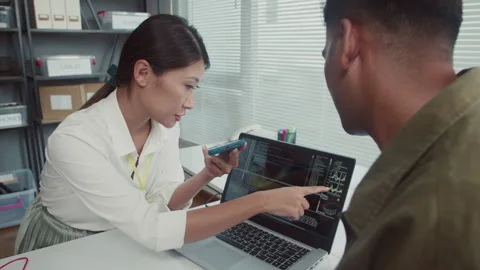 Repair Specialist and Client Checking Work of Devices Using Software Equipment Stock Footage 261663522