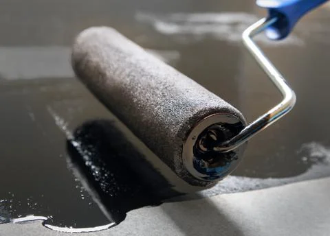 Repair using a paint roller and mastics Stock Photos