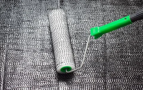 Repair using a paint roller Stock Photos