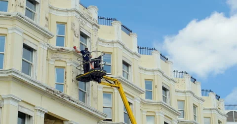 Repair work on building Stock Footage 64712542