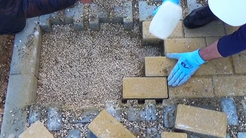 Repair work on a paving with self-locking blocks..After removing the blocks, Stock-Footage 104042585