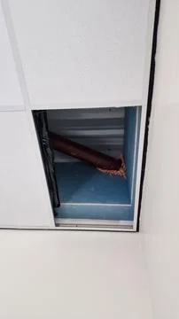 Repair work to piping in a ceiling Stock Photos