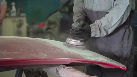 Repair work to restore the paintwork in the garage by a professional concept Stock Footage 153488914