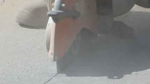 Repair work on the road. A worker saws asphalt. Stock Footage 131959769