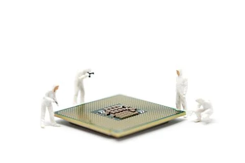 Repair workers inspecting computer's CPU Stock Photos