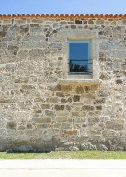 Repaired facade stone house Stock Photos