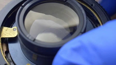 Repairing Camera Lens Disassembling Lens and Mechanical Parts Close-up Stock Footage 121084861