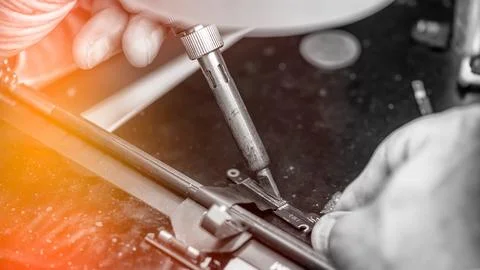 Repairing computer connector in electronics lab with precision tools close .. 写真素材
