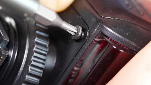 Repairing electronics with a screwdriver in a local workshop Stock Footage 333247852
