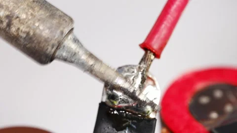 Repairing electronics with soldering techniques in a workshop Stock Footage 333246671