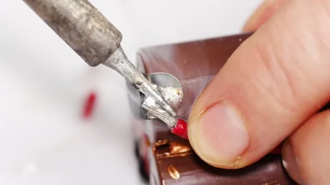 Repairing electronics with soldering techniques in a workshop Stock Footage 333246682