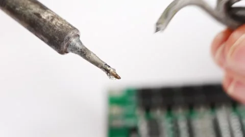 Repairing electronics with soldering tools in the workshop Stock Footage 333246370